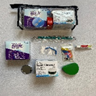 Kit with various small items and tools.