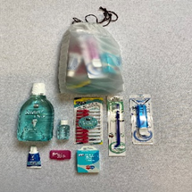 Personal care items arranged on a surface.